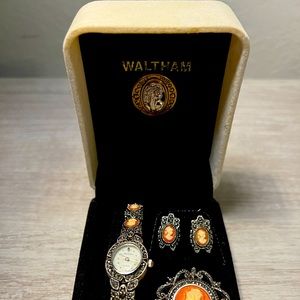Women’s Waltham vintage watch, brooch and earrings set in original box.